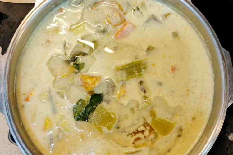 Tamil Nadu-Style Avial is a traditional South Indian dish, known for its vibrant yellow hue and tangy flavor. This wholesome recipe combines a variety of fresh vegetables, coconut, and yogurt, creating a unique and delicious curry.