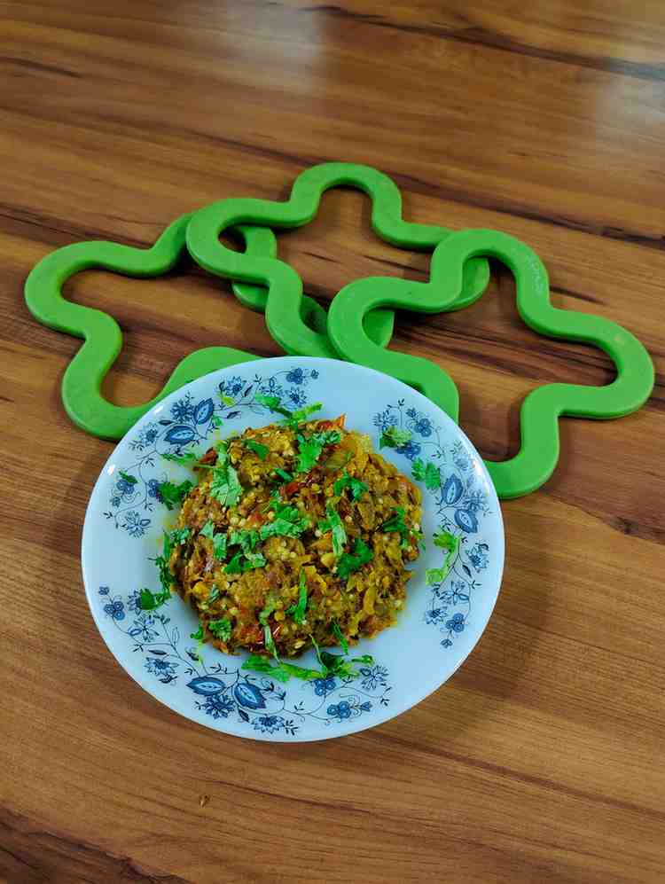 Baingan Bharta is a traditional Indian dish known for its smoky flavor and rustic charm.