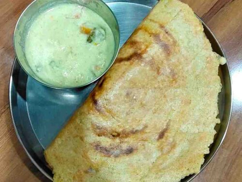 Adai is a traditional South Indian savory pancake. It's made with rice and dals and spiced with red chilies. Enjoy this delicious and nutritious dish, perfect for breakfast or a wholesome snack.