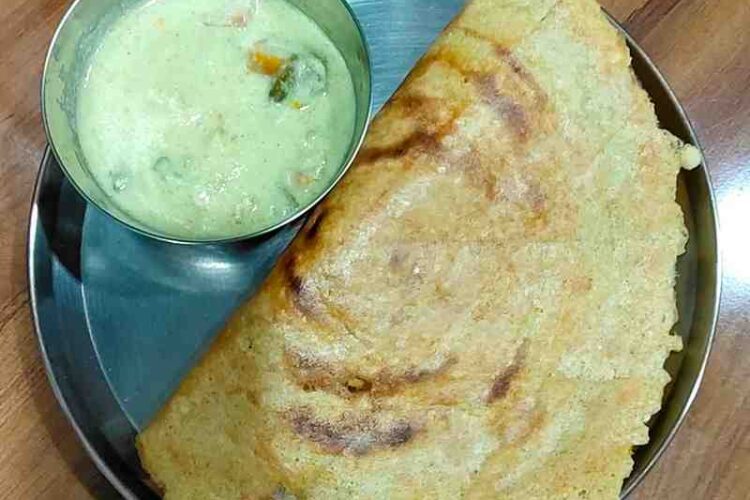 Adai is a traditional South Indian savory pancake. It's made with rice and dals and spiced with red chilies. Enjoy this delicious and nutritious dish, perfect for breakfast or a wholesome snack.