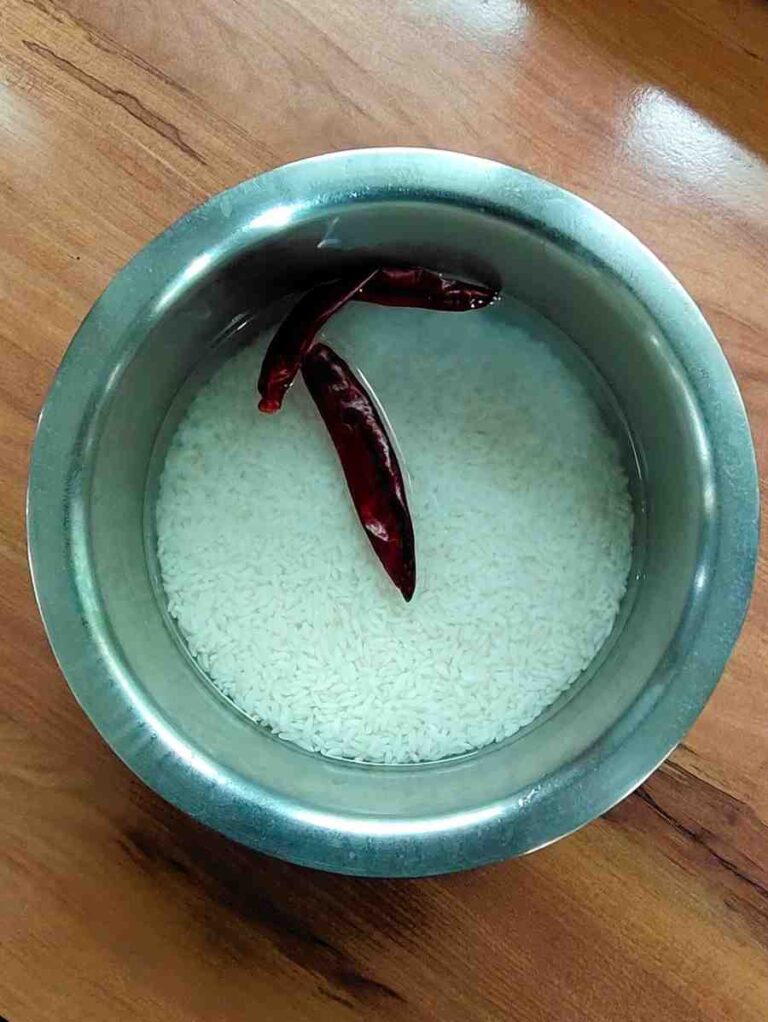 Adai Soak Rice in Water Soak rice in water with red chillies