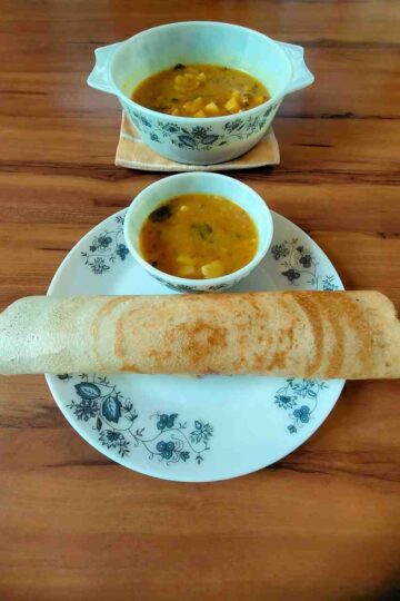 Crispy dosa served with Aloo Saagu, a potato delicacy from the Udupi region.