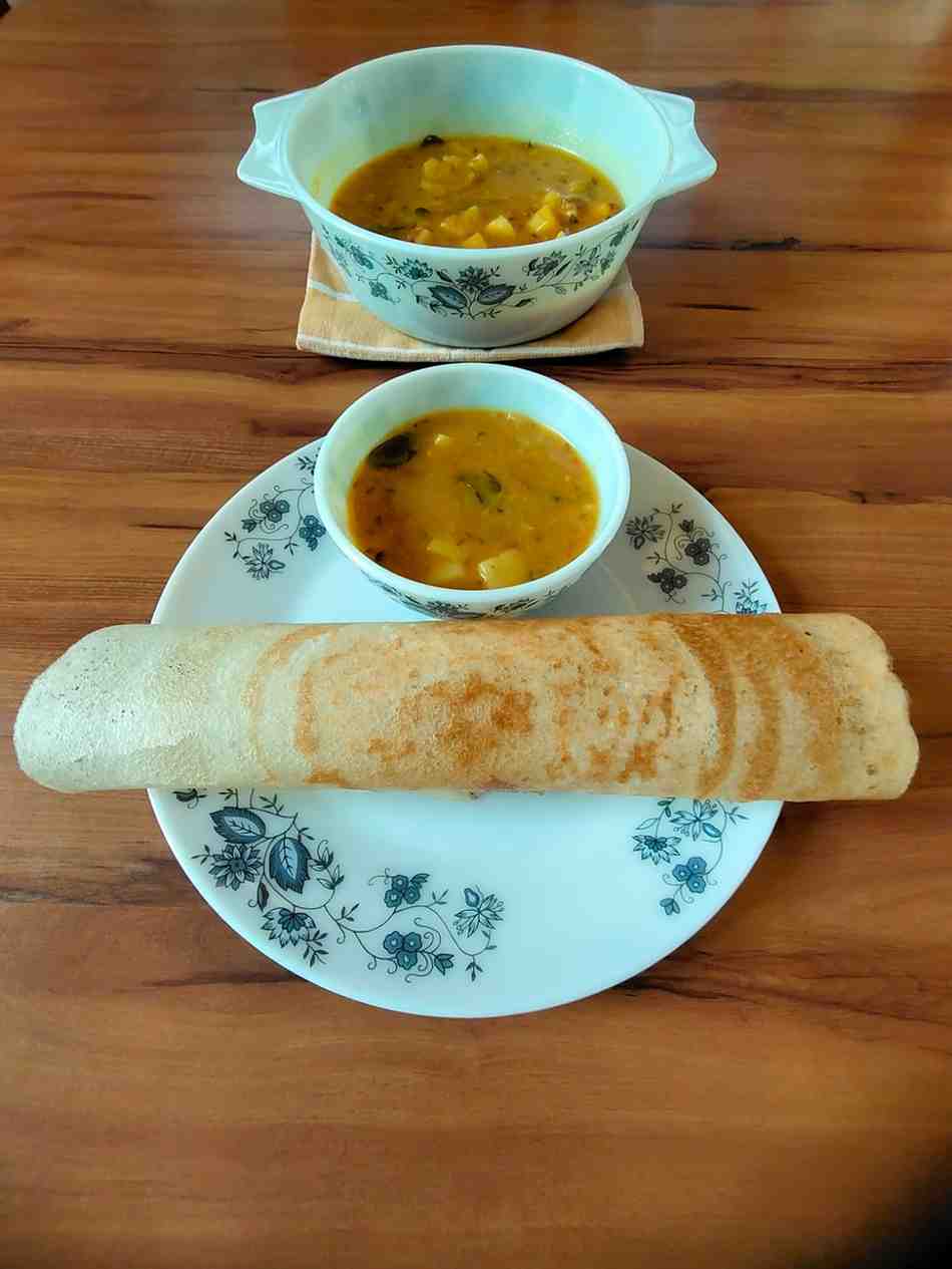 Crispy dosa served with Aloo Saagu, a potato delicacy from the Udupi region.