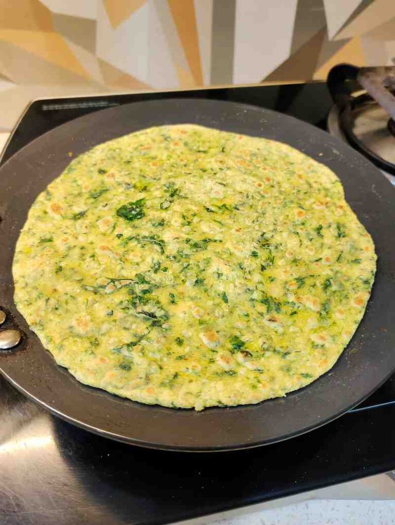 Methi Paratha Frying Cooking the Methi Paratha on a griddle or tawa