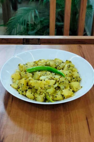 Delve into the flavorful Aloo Posto recipe, a cherished Bengali dish featuring tender potatoes cooked in a rich and nutty poppy seed paste. This delightful and aromatic dish is perfect for a comforting meal with rice or roti.