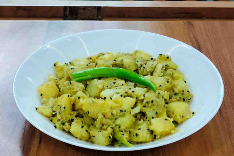 Delve into the flavorful Aloo Posto recipe, a cherished Bengali dish featuring tender potatoes cooked in a rich and nutty poppy seed paste. This delightful and aromatic dish is perfect for a comforting meal with rice or roti.