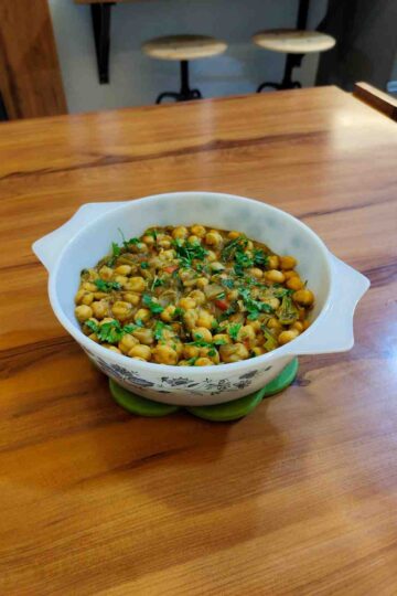 Discover this authentic Punjabi Chole recipe, a rich and aromatic chickpea curry loaded with bold spices. Perfect with bhature, puris, or rice!