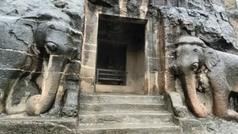 Elephant carvings at the entrance of Ajanta Cave 16