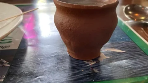 Assam tea served in a clay cup near Kaziranga