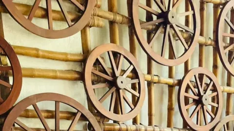 Cartwheel and bamboo wall at Borgos Resort, Kohora