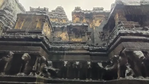 Kailasa Temple resting on a row of carved elephants, Ellora