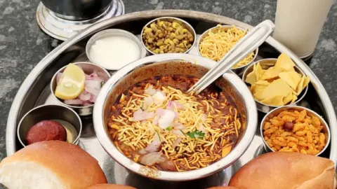 Misal pav thali with tarri near Khuldabad