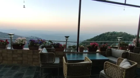 Norbu House terrace dining with a valley view