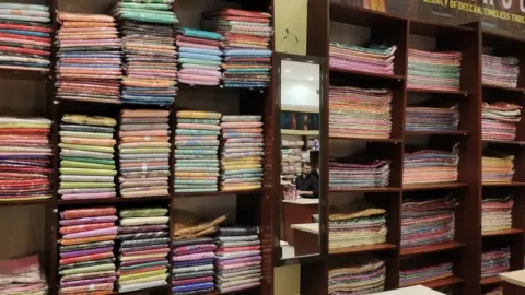 Shelves of Paithani sarees
